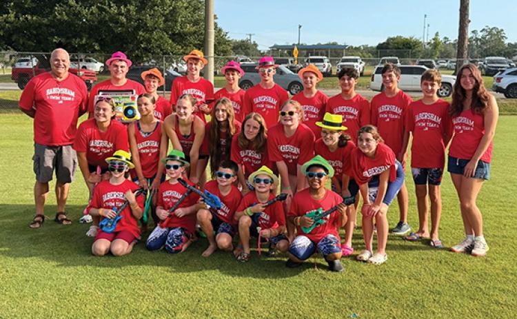 The 2026 Habersham County state swim team includes (front row) Ryelin London, Jonah McEntire, Grayson Free, Rowan Schofill, Omar Nunez, (second row) AbbyGrace Head, Ava Free, Kayleigh McEntire, Naomi Russo, Emmeline Penland, Ellie Gates, Adalynn Sheffield, Adalyn Reynolds, (back row) Coach Mike Krippner, Noah Reynolds, Elliott Rudeseal, Lincoln Penland, Luke Russo, Logan Thompson, Jameson Thompson, Ty Beack, Brody Kastner, Lucus Woodworth and Coach Sadie Hagel pose at the State Swim Meet in Moultrie. 