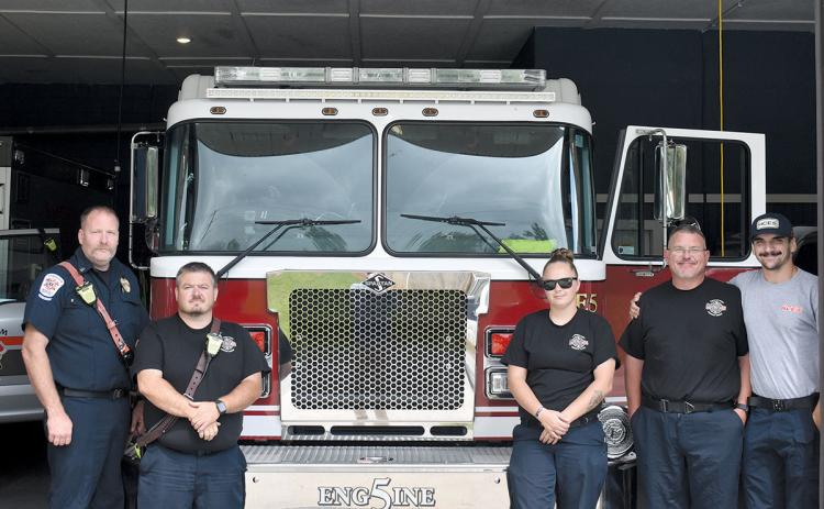Station 5’s Brandon Whitney, Keith Borton, Kayden Harper, Tyler Downs and Kyle Cash continue working as station renovations near completion. (Noah Ansley/Staff)