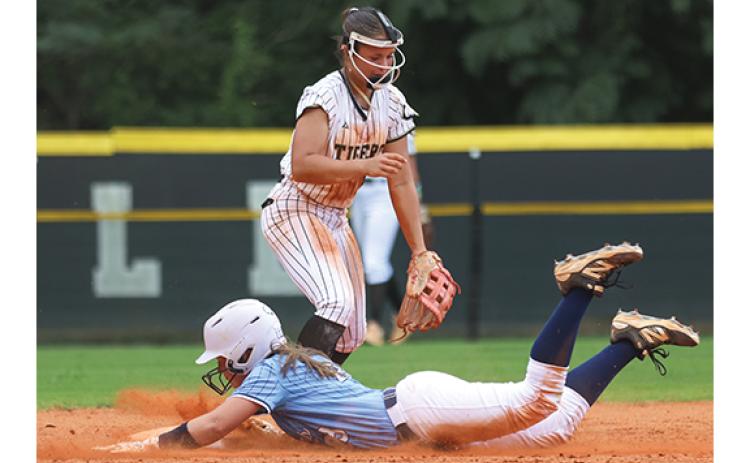 Habersham Central outfielder Sydney McCalmon (23) slides in safely during the softball game between Habersham Central and Commerce at American Veterans Memorial Park on Wednesday, Aug. 5. (Landen Todd/Staff)