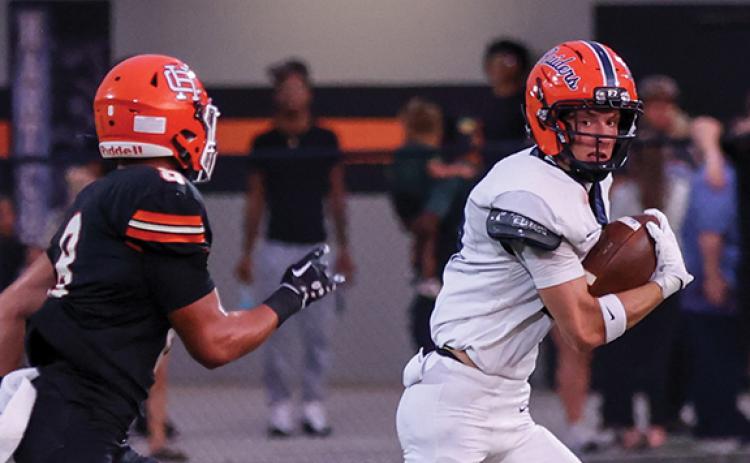 Habersham Central senior wide receiver Drake Roland (19) runs with the ball during the football game between Habersham Central and Hart County at Herndon Stadium on Friday, Aug. 21. (Landen Todd/Staff)