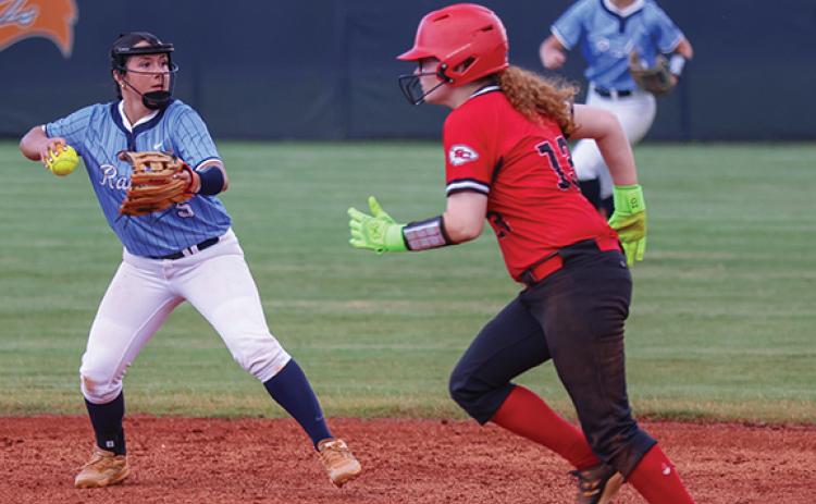Habersham Central infielder Oaklee Jackson (5), left, throws the ball during the softball game between Stephens County and Habersham Central  at Raider Field on Monday, Aug. 3. (Landen Todd/Staff)