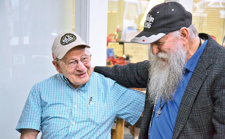Billy Burrell chats with John A. Harris at his 90th birthday in 2020. (File)