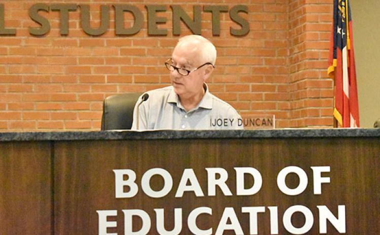 Habersham County Board of Education Chairman Joey Duncan asks for a motion to approve the donation of surplused property to Rabun County E-911 during Monday night's regular meeting. (Hannah Caudell/Staff)