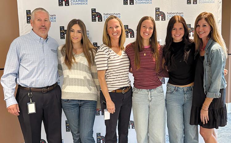 HEMC President and CEO Bryan Ferguson, (Leadership Habersham Class of 2015) and daughter Anna Ferguson; Trailwave Fiber Broadband Sales Representative Alice Dover (Leadership Habersham Class of 2014) and daughter Ally Dover; Caroline Horton and mother HEMC Director of Community Relations Mary Beth Horton (Leadership Habersham Class of 2011) celebrate having another generation in their families participating in Leadership. (Submitted)
