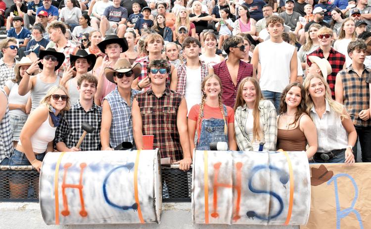 Dacie Mash, Parker Homa, Carson Crane, Ethan Wheeler, Emmie Kyle, Zoey Sosbee, Megan Eash and Kaylan Barrett and the rest of the Raider Rowdies prepare to cheer on Habersham Central as they get ready to kick off against Stephens County. (Noah Ansley/Staff)