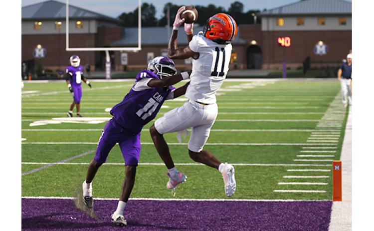 Habersham Central senior wide receiver Jay Feltus (11) makes a leaping touchdown grab during the football game between Habersham Central and Monroe Area at the Purple Pit on Friday, Sept. 4. (Landen Todd/Staff)
