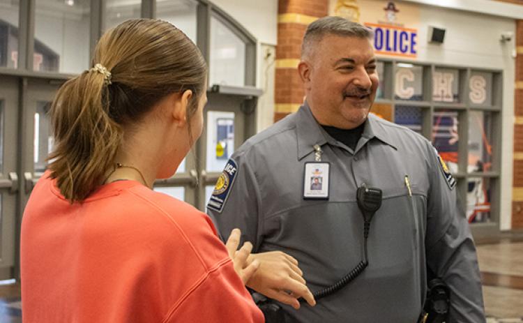 Habersham School Police Department Chief Murray Kogod laughs while talking with students in the front entrance of Habersham Central High School. (File)