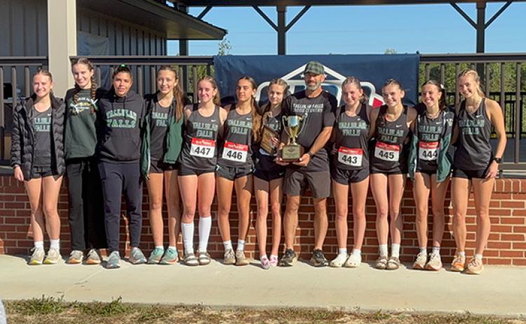 Tallulah Falls state champions Veronica VerBerkmoes, Megan Prince, Eloa Barbosa, Sofia Alderfer, Ida Patterson, Leyre Martinez, Naomi Russo, TFS Coach Jamie Jimison, Lily Denard, Avery Keim, Olivia Henderson and Mary Kate Ball pose with the trophy at Middle Georgia College and State University on Saturday, Oct. 24. (Submitted)