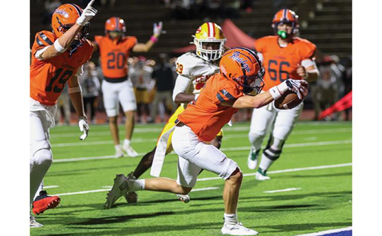 Habersham Central wide receiver Drake Roland (19), running back Kenley Bee (20) and center Cy Shirley (66) watch sophomore wide receiver Preston Tatum (5) score a touchdown during the football game between Clarke Central and Habersham Central at Raider Stadium on Friday, Oct. 9. (Landen Todd/Staff)