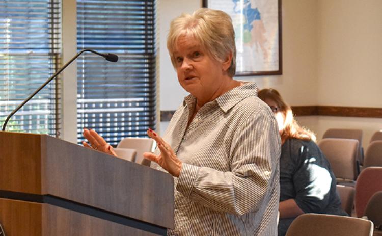 Evelyn McClain, a Cornelia resident and frequent meeting-goer, tells commissioners she would like them to reconsider the merit-based raises offered to eligible employees. (Hannah Caudell/Staff)