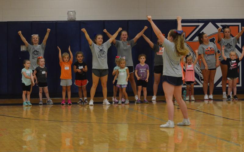 Campers perform a cheer at the beginning of the Future Lady Raiders Cheerleading Camp Tuesday.