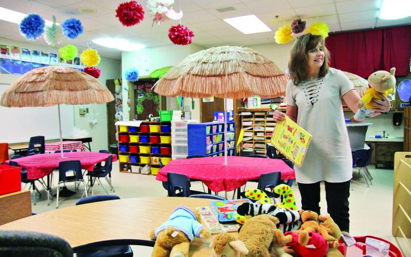 Demorest Elementary School kindergarten teacher Allison Roland decorates her classroom.