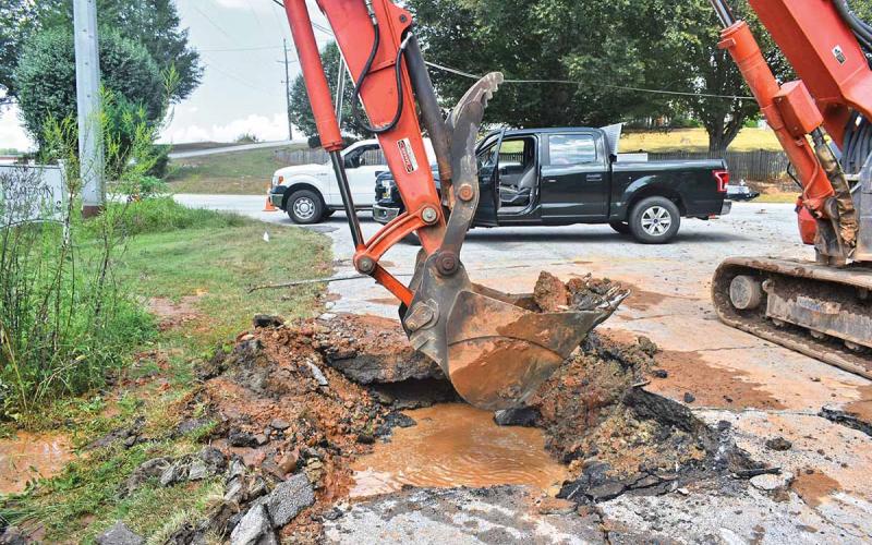 The city of Clarkesville issued a boil water advisory Tuesday as it worked to fix a 10-inch line that ruptured on Gabrels Drive. (Photo/CHAMIAN CRUZ)