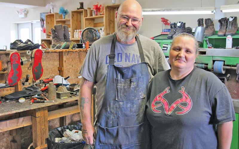 Becky and Billy Bending have owned Country Cobbler Shoe Repair in Cornelia for nearly five years. Billy Bending has been a cobbler for over 30 years and Becky Bending has been in the profession for over 20 years. (Photo/ERIC PEREIRA)