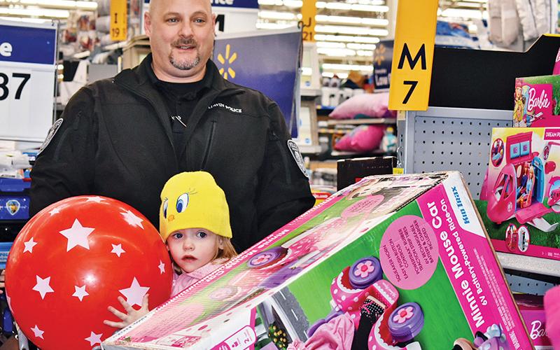 Though small, 3-year-old Lilith Chambers took the opportunity get some big gifts Thursday morning with Lt. Shuk Hamdan of the Baldwin Police Department. The shopping spree was due to Baldwin's annual Shop With a Hero, where 15 total children this year had a budget of $300 to get whatever they wanted. 