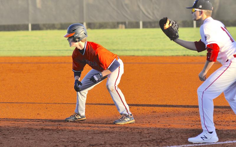 Habersham Central’s Rhett Addis (7) gets a lead off of first base during the Raiders 5-4 loss to Stephens County High School Friday in Toccoa. 