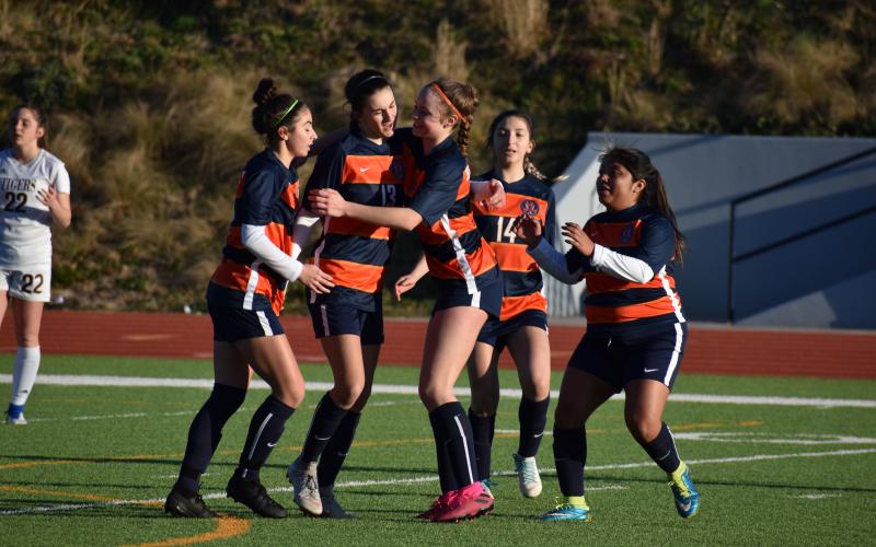 Habersham Central’s Anna LaBarbera, from left, Addie Penick, Sydney Turner, Abigail Deleon and Maria Miguel celebrate a goal from Penick during the second half of the Lady Raiders 5-2 victory over Dawson County High School Friday.