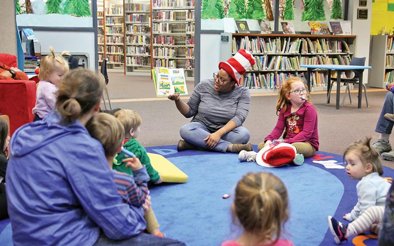 Clarkesville Library hosted a Dr. Suess celebration as the world famous children’s author’s birthday was March 2. Children gathered for arts and crafts activities and reading Thursday. Youth Services Specialist Ashawna Green, children and parents gather for story time.