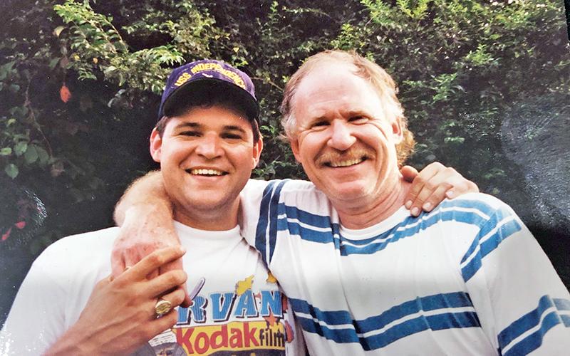 Judge James Butterworth, right, stands with his son, Jim Butterworth. Jim Butterworth said the world has lost “a lion” with the death of his father.