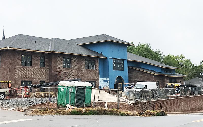 The new Cornelia administration building is scheduled to be open by the end of May, but bad weather has slowed the outdoor portions of the construction, City Manager Donald Anderson said Thursday.