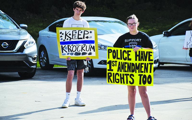 Tucker Demore and Saylor Krockum were among many in the Demorest City Hall parking lot Tuesday hoping to hear from the City Council. 