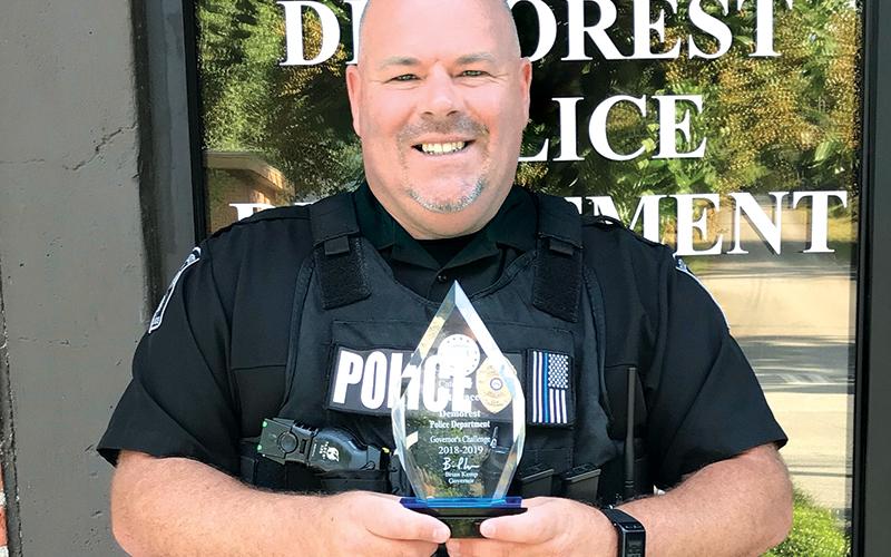 Former Demorest Police Chief Robin Krockum shows off the department’s award for best highway safety in the state in 2018-19.