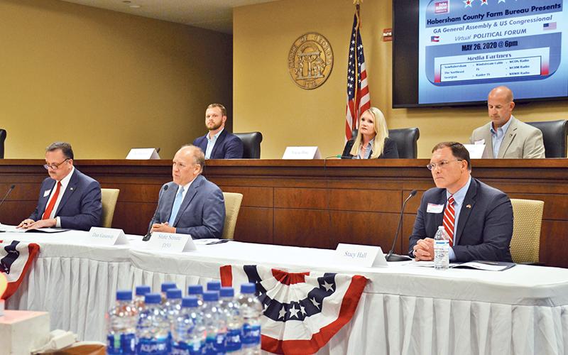 Candidates for State Senate District 50 listen to each other’s comments Tuesday night. Bottom row from left are Andy Garrison, Dan Gasaway and Stacy Hall, and top row from left are Bo Hatchett, Tricia Hise and Lee Moore.