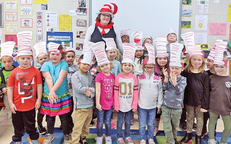 Deana Snowden celebrates the legacy of Dr. Seuss with her Demorest Elementary pre-K students earlier this school year.