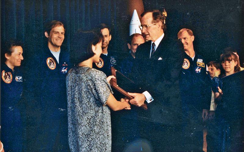 May Chan (now May Chan Nelson) meets President George H.W. Bush at the White House after she and her fellow students won a national contest naming the Endeavour shuttle.