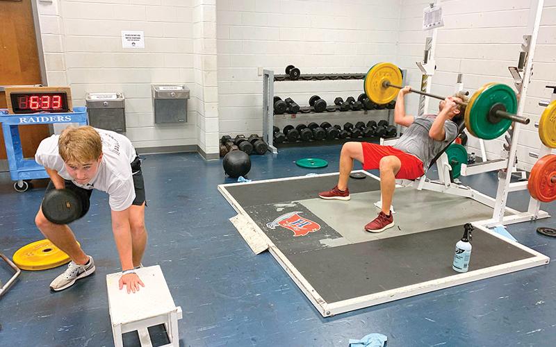 Habersham Central’s Grant Tipton (left) and Gabe Hudlow run through weight training and drills earlier this week after returning to campus for the first time since the COVID-19 shutdown.