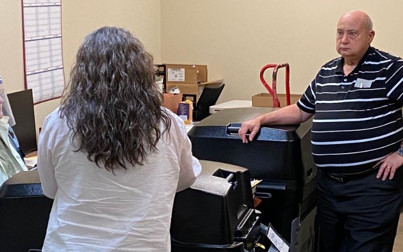 Board of Elections Chairman Carroll Jeffers and Elections Supervisor Laurel Ellison count the ballots stuck in the voting machines of the June 9, 2020 recount.
