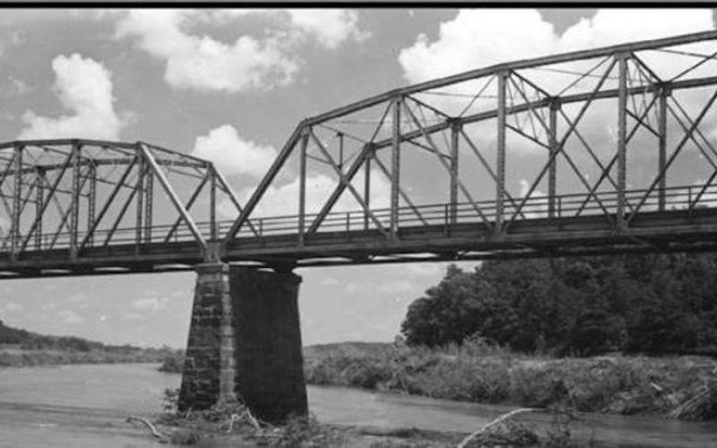 This rare photo shows Broken Bridges while it remained intact. Notice it was taken prior to the impounded of Lake Hartwell. That’s the Tugaloo River flowing beneath the “camelback” truss bridge.