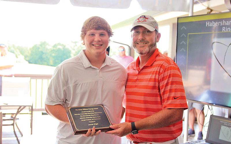 At the beginning of the ceremony, Lincoln Wright was presented the Jimmy Williams Courage Award (right photo). The award is presented annually to a Habersham Central senior football player that most embodies traits of athleticism, scholarship, integrity and more. Presenting the is Habersham Central Football Head Coach Benji Harrison.