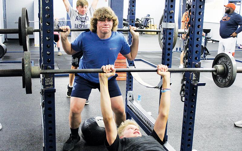 Despite the season being delayed, Wesley Sisk (top) and Jonah Wilson (bottom) are putting in work with sets of squats and bench presses during Habersham Central’s football workouts. Practice begins on July 27, and the Raiders are scheduled to open Sept. 4 against Madison County.
