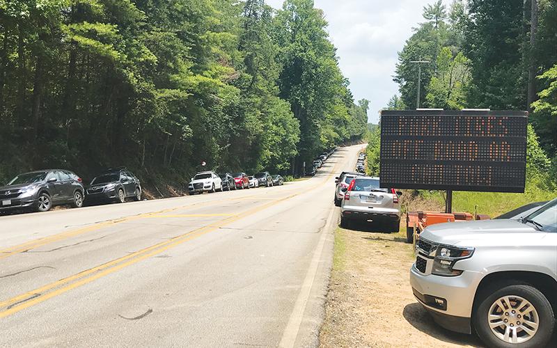Crowds were heavy at Panther Creek on Fourth of July weekend, including some cars that were towed for being illegally parked.