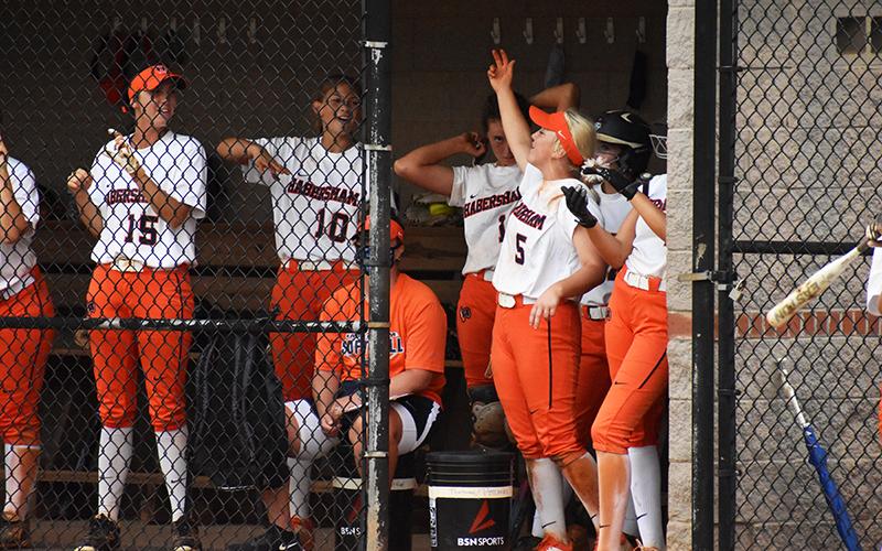 Habersham Central’s softball players support their teammate at bat during Wednesday’s win over Flowery Branch.