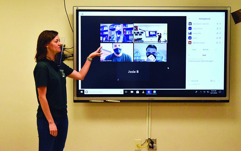 Dallas Barron demostrates Tallulah Falls’ blended learning technology for the 2020-21 school year. The system helps international students participate until they can return to campus later this semester.