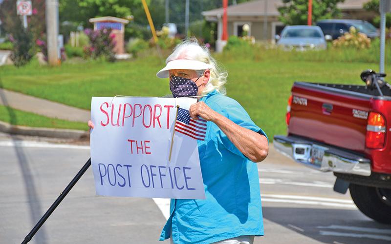A local woman, who did not want to give her name out of fear of retaliation for her beliefs, wanted everyone in Clarkesville to know how vital the U.S. Postal Service is as she demonstrated for more than an hour on the morning of Aug. 22.