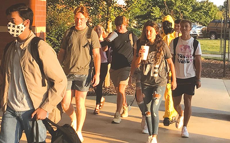 Excited students hurriedly entered Habersham Central High School on Tuesday morning, with one student taking extra precautions against the lingering pandemic.