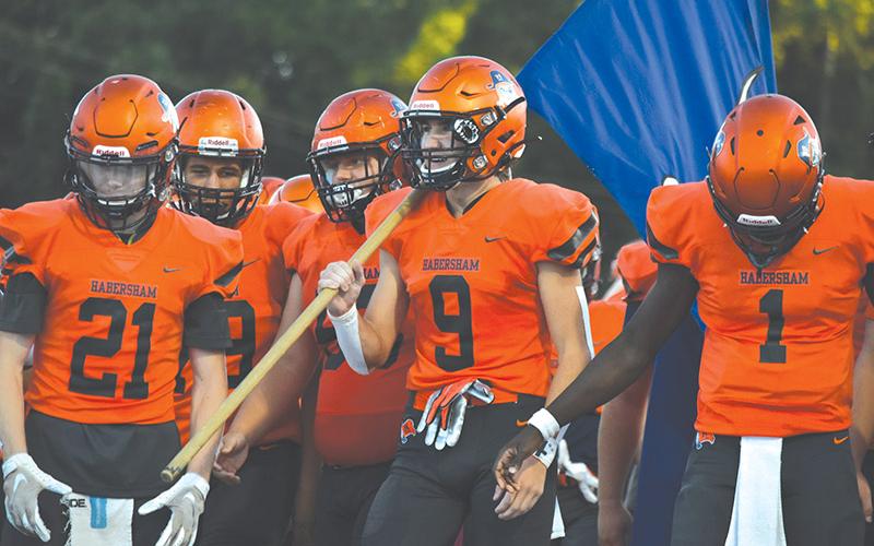 Habersham Central’s Gage Hurt (9), Austin Wood (21) and Josh Pickett (1) prepare to lead the team onto the field for the opener last Friday. LILLIAN VAN TASSEL/Special