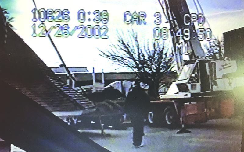 An image from the video taken by a Clarkesville Police patrol car camera shows the roof of the Clarkesville gazebo removed by a large crane on Dec. 26, 2002.