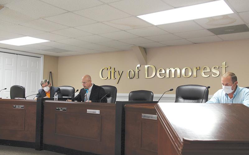 Councilman John Hendrix, Mayor Rick Austin and Councilman Nathan Davis conduct business at the Tuesday night meeting. 