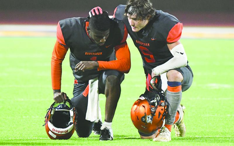 Habersham Central’s Gage Hurt (9) consoles teammate Joshua Pickett after Friday’s loss to White County. Despite the loss, these Raiders have a lot to feel good about at this point in the season. TOM ASKEW/Special