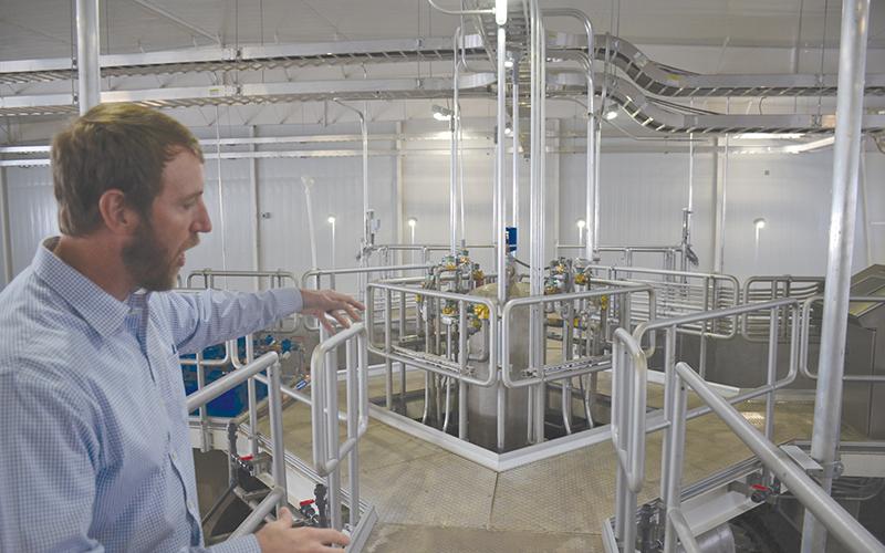 Carter & Sloope engineer Jeremy Pirkle shows off the plant’s one-of-a-kind new filtration system.
