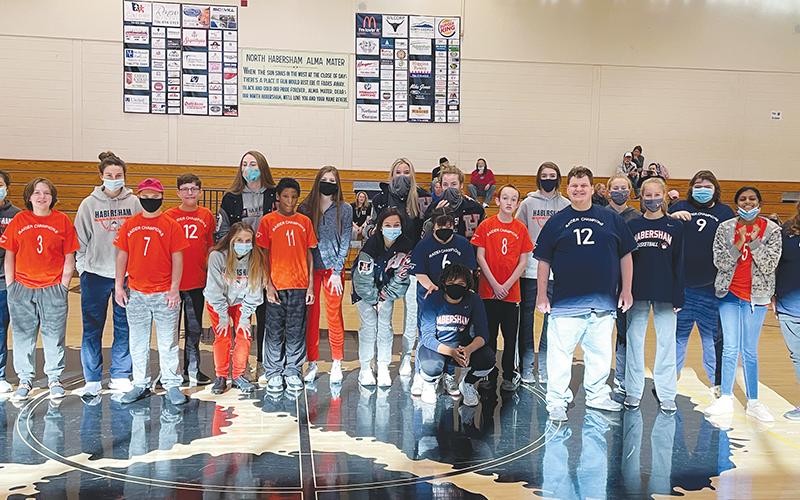Members of the Raider Champions League take a photo with volunteers from the Lady Raiders basketball team. The league was started by Judy Thompson, a special education teacher at North Habersham Middle School, with the goal of allowing participants to have fun and participate equally in the game of basketball. JUDY THOMPSON/Submitted