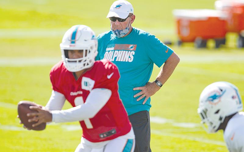 Chan Gailey of Clarkesville coaches Tua Tagovailoa with the Miami Dolphins earlier this season. Gailey left the Dolphins Jan. 6 ending what could be his last coaching stop. ALLEN EYESTONE/Courtesy of Palm Beach Post