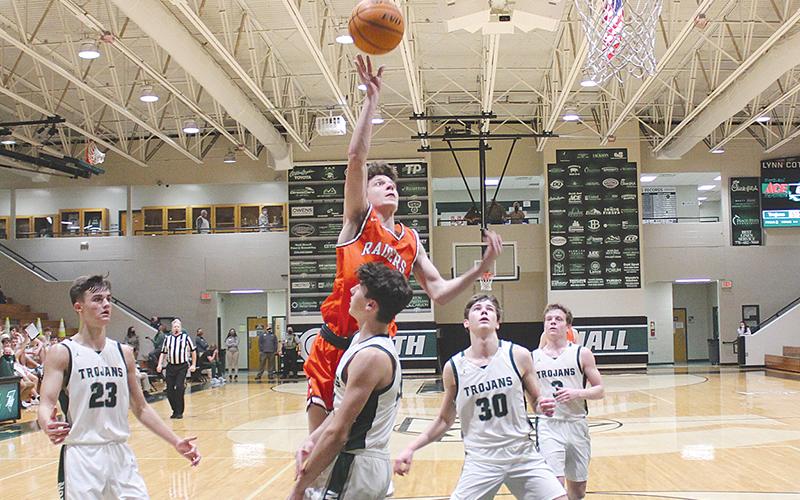 Sophomore Cole Gary looks to finish over a Trojan defender during  Tuesday night’s 57-47 loss at North Hall.