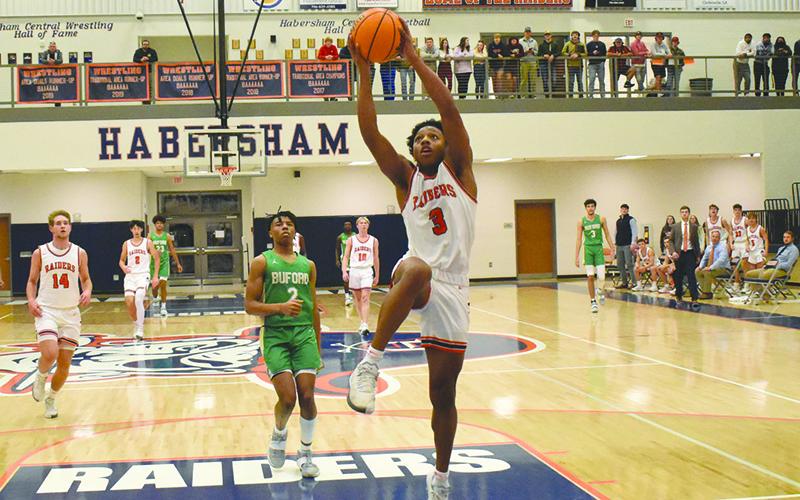 Habersham Central’s guard Malachi Dooley elevates for a layup against Buford in December.