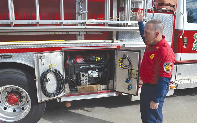 Demorest Fire Chief Ken Ranalli explains the process his staff has to go through to get additional lighting at an emergency scene, including pulling a generator stored in the department’s pump truck. The truck has been in service in Demorest for 25 years.