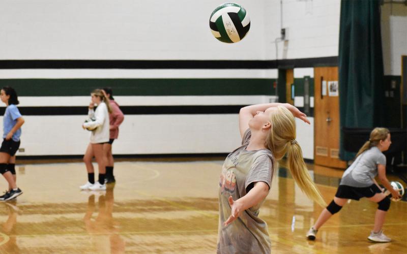 Kate Gary works on a floating serve during camp Tuesday. ISAIAH SMITH/Staff